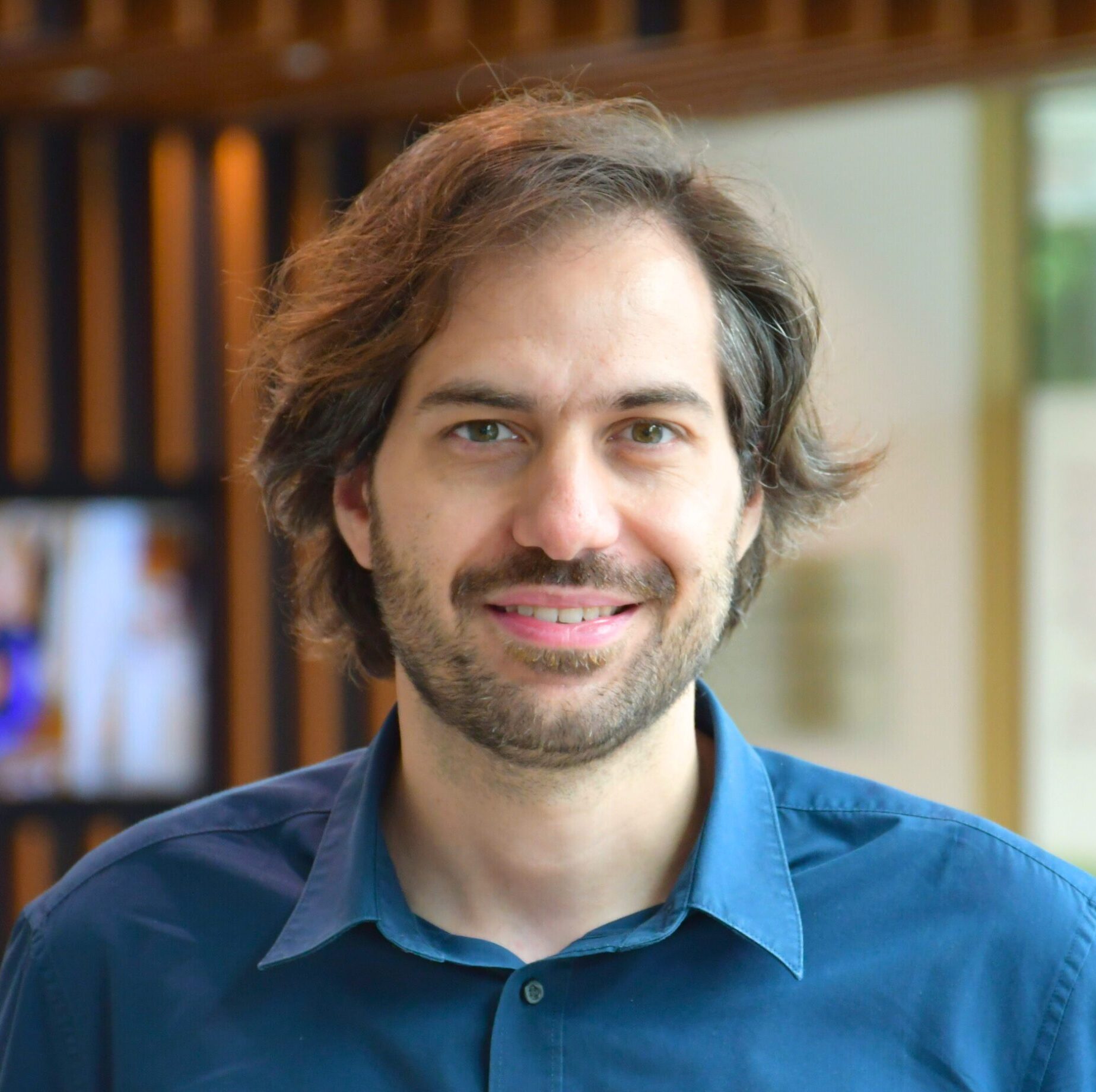 Portrait photograph of Dr Evangelos Giampazolias in the Paterson Building reception