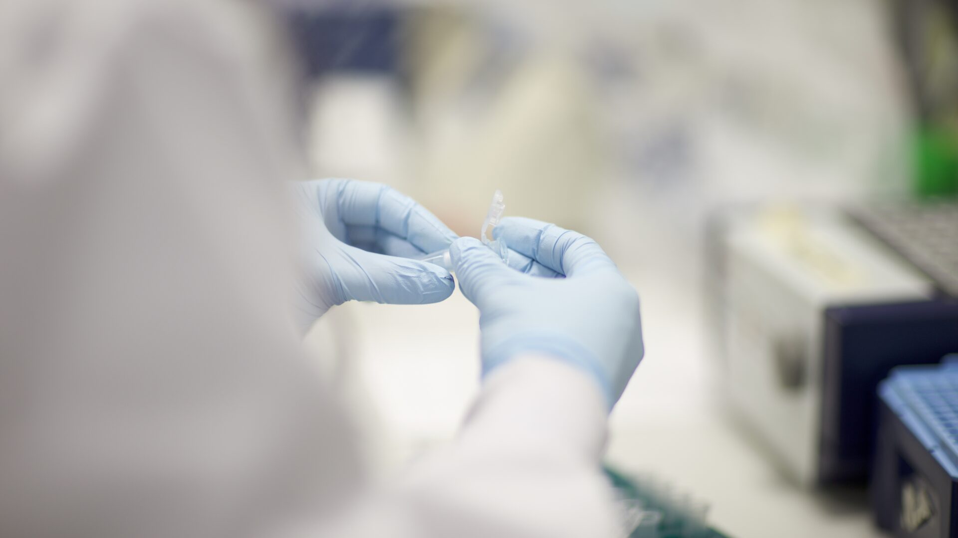 Scientist hands holding eppendorf in lab