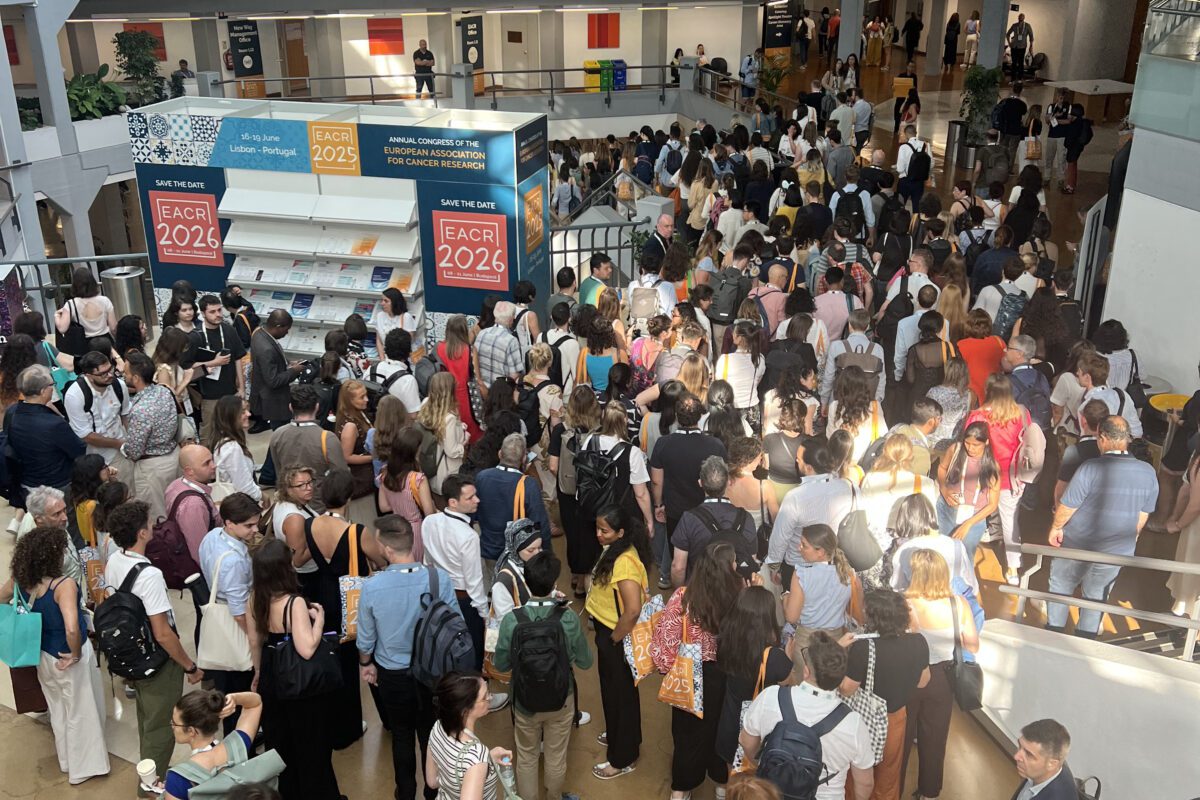 Wide shot of attendees in the main conference hall at EACR