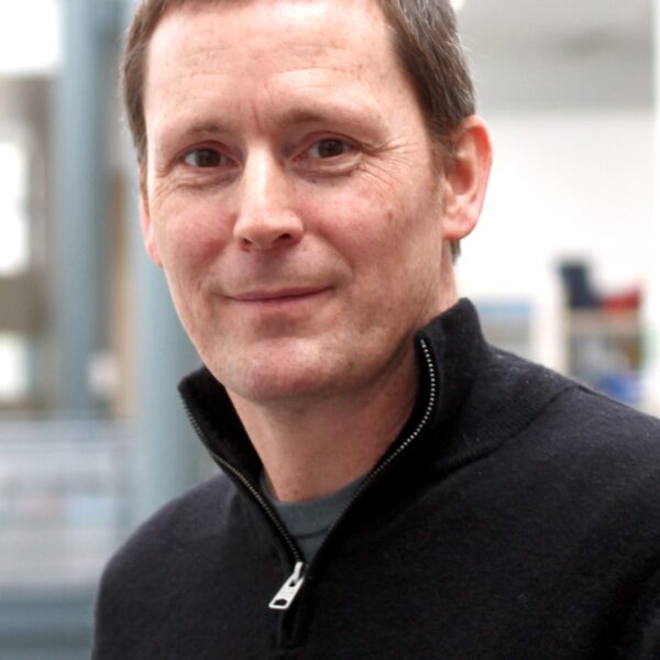 A headshot of Magnus Rattray